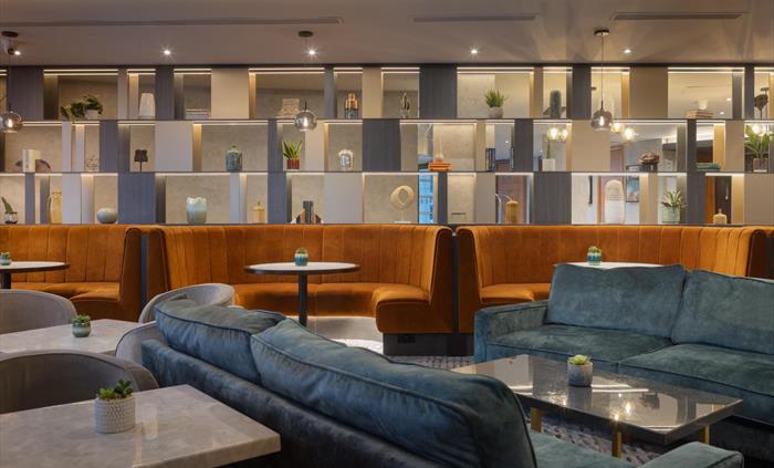 Graze bar is conveniently situated for meeting colleagues over coffee, unwinding with drinks, and enjoying delicious food.